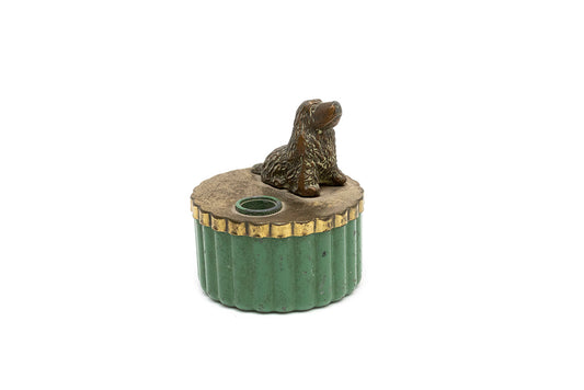 Bronze plated spaniel sits atop a gold plated top beside the pencil sharpener fitted to a green metal cup