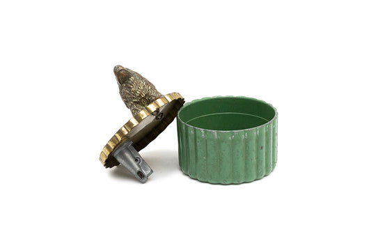 open vintage metal pencil sharpener shows the bronze plated spaniel attached to the gold plated lid leaning on the separate green metal cup