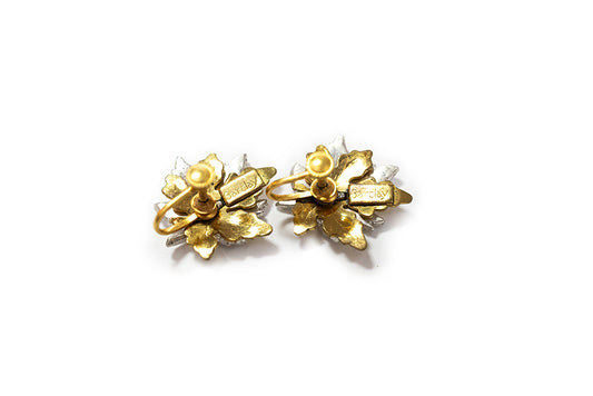 back view of vintage gold-plated maple leaf earrings shows screwbacks and maker mark "Barclay"