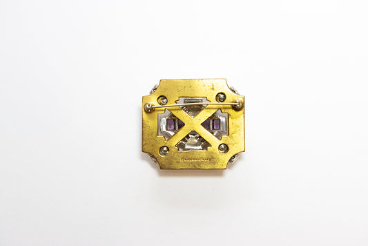 back view of McCLELLAND BARCLAY Art Deco gold plated square brooch with purple and clear rhinestones shows the maker's mark and open work design