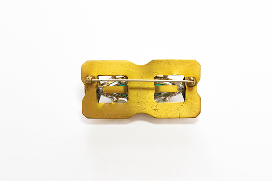 back view of McClelland Barclay vintage gold-plated rectangular Art Deco style brooch shows the horizontal pin and the faint makers mark