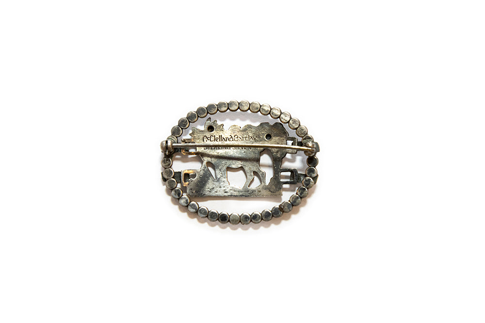 Back view of sterling silver elk brooch with "McClelland Barclay" and "STERLING SILVER" marks