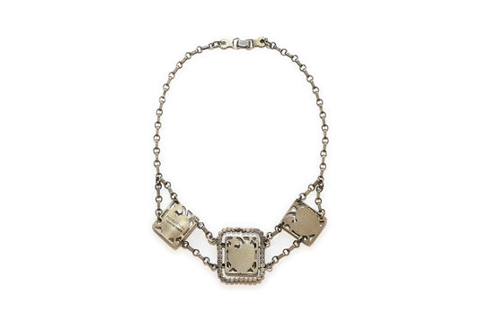 back view showing McClelland Barclay sterling silver mark on vintage 1930s Art Deco necklace with hearts and flowers in three plaques linked together