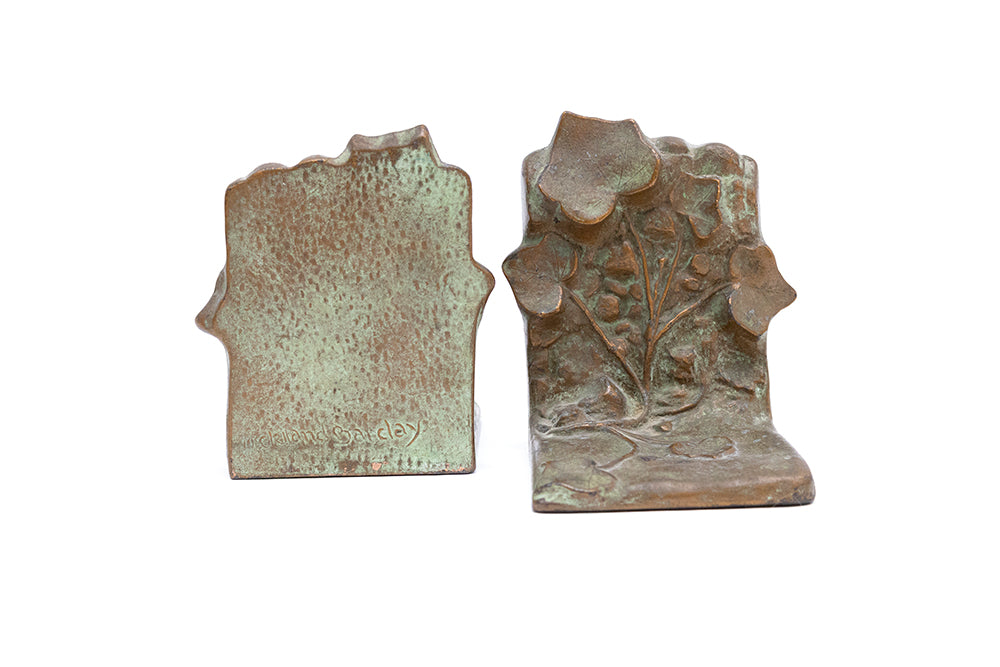 Signed Art Deco plated bronze and "McClelland Barclay green" bookends made in the 1930s, front and back views