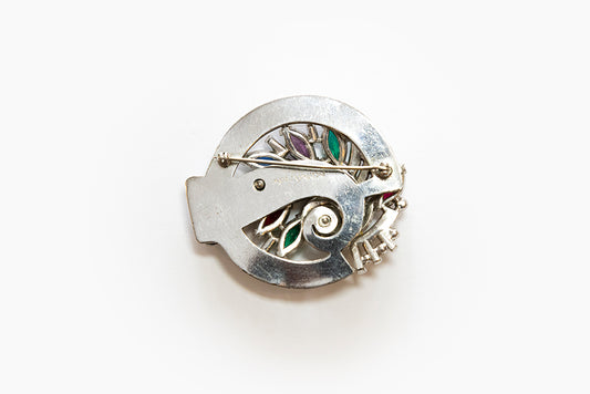 back view of silvertone swirl brooch with McClelland Barclay mark