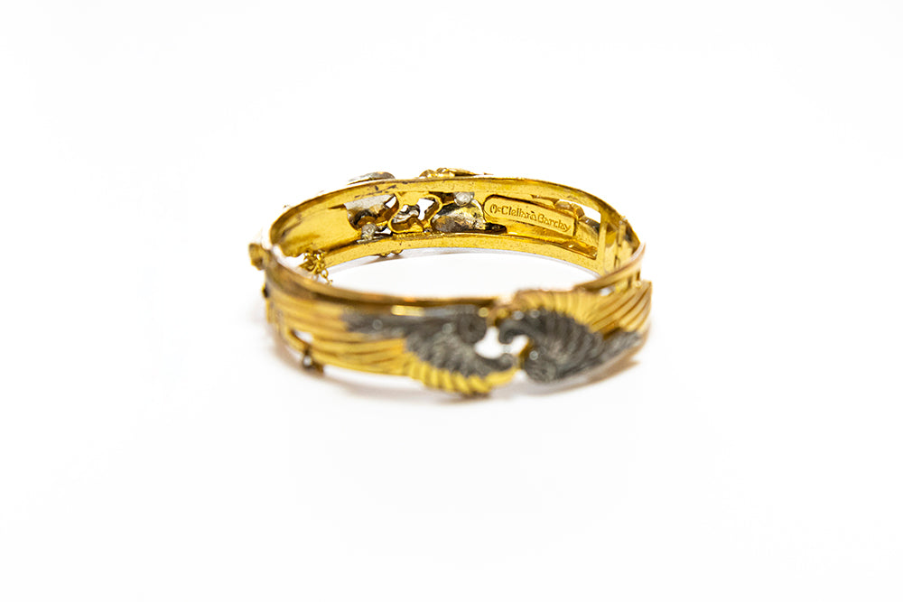 signature on inside of McClelland Barclay Art Deco two-tone gold and silver double winged hinged cuff bracelet