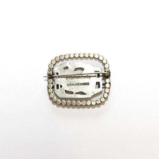 Back view of sterling silver Art Deco dove brooch with beaded frame signed McClelland Barclay