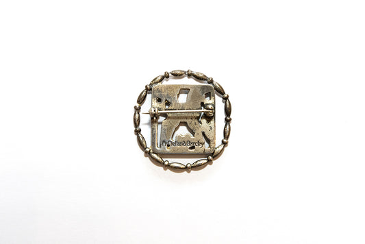 back view shows sterling and makers mark McClelland Barclay sterling silver lamb brooch in beaded round frame