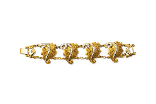 Gold plated acanthus leaf link bracelet with clear rhinestone accents