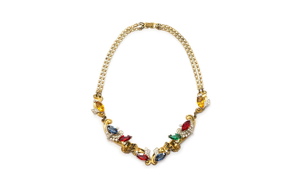 rare MCCLELLAND BARCLAY Art Moderne gold plated with red, green, blue and clear rhinestone swirls necklace c. 1940