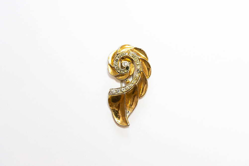 Vintage gold plated and rhinestone swirl fur or dress clip by McClelland Barclay, part of a matching pair
