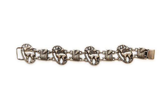 Deer and pinecones are the alternating motifs in this vintage McClelland Barclay Art Deco sterling silver bracelet