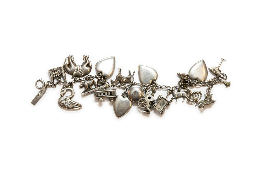 Rare 1930s vintage sterling charm bracelet with twelve different Americana themed charms