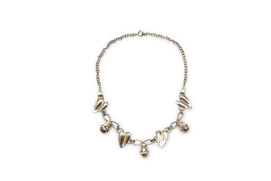 Vintage McClelland Barclay sterling silver chain necklace has four heart-shaped leaves alternating with three flower buds 