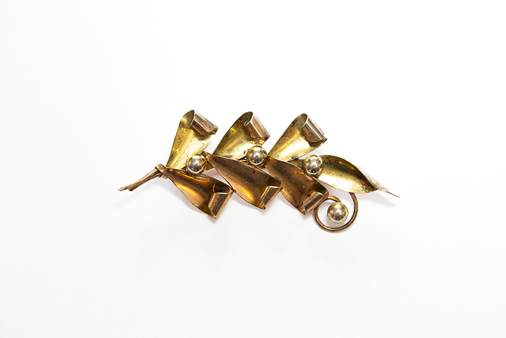 Vintage McClelland Barclay brooch in two-tone sterling vermeil  has curled leaves and buds 