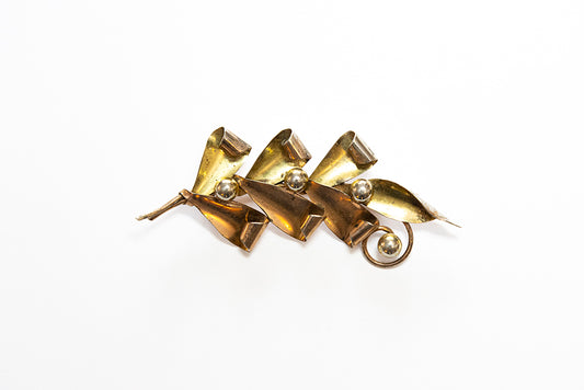 Vintage McClelland Barclay brooch in two-tone sterling vermeil  has curled leaves and buds 