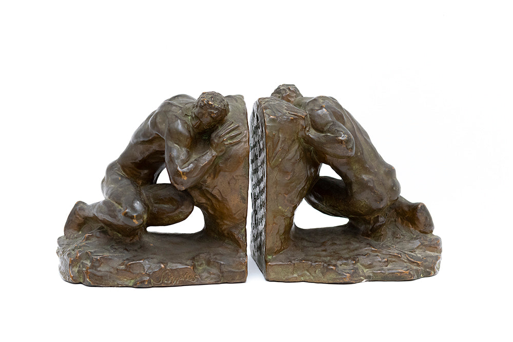 Side by side view of bronze plated Sisyphus bookends by McClelland Barclay Art Products from the 1930s