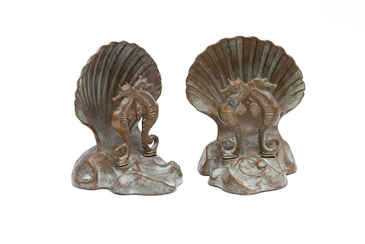Pair of 1930s McClelland Barclay Art Deco bookends with seahorses and shells have the unique green plating created by the artist