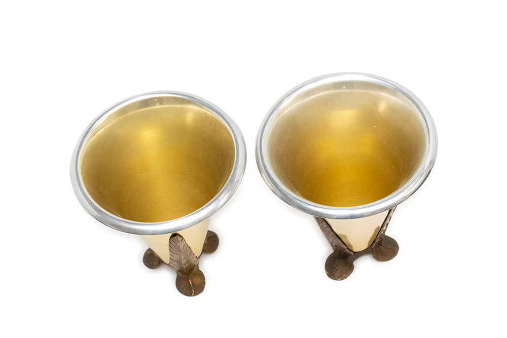 Top view of Pair of McClelland Barclay Art Deco aluminum vases with antique gold leaf holders from 1930s