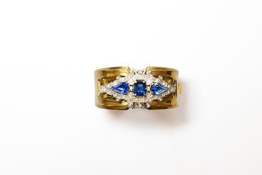 Art Deco hinged cuff bracelet by McClelland Barclay is embellished with blue and clear rhinestones