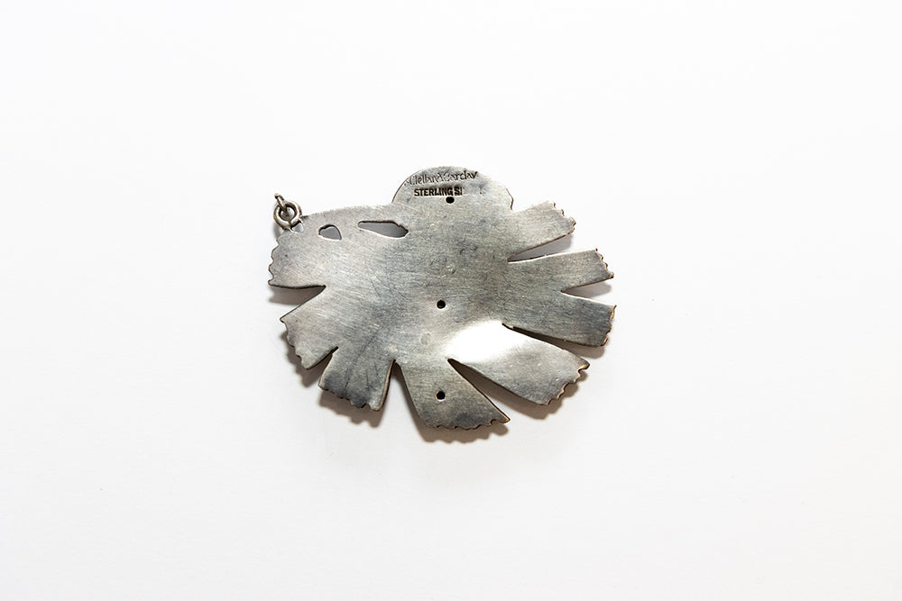 Back view of a vintage McClelland Barclay sterling silver pine cone pendant
