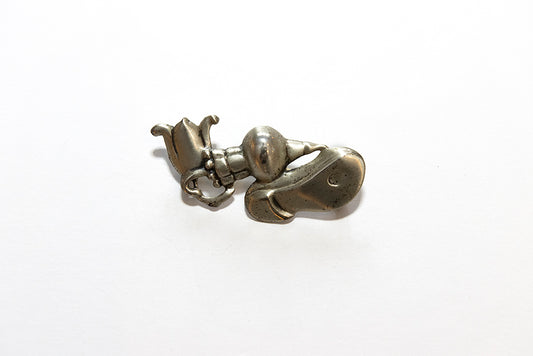 A vintage Art Deco Depression Era political themed sterling silver brooch by McClelland Barclay